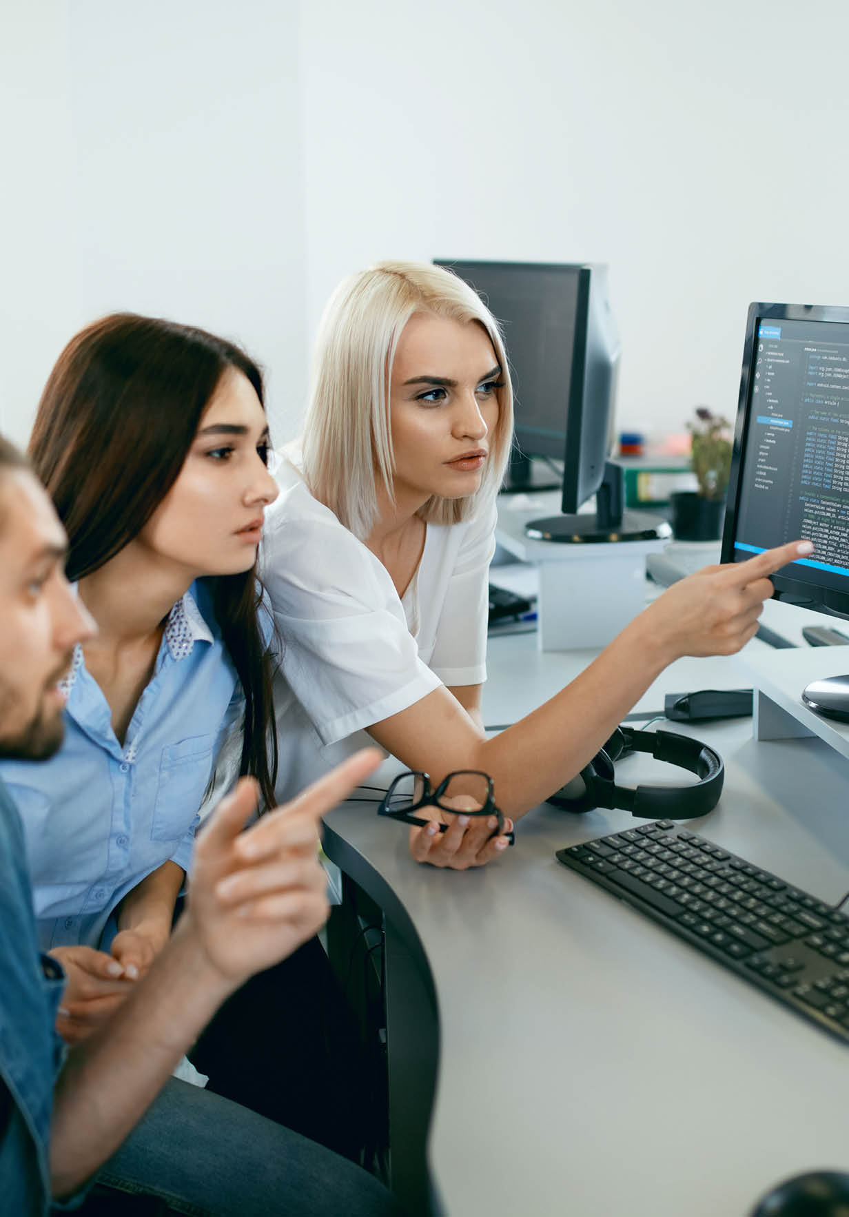 IT office. People Working At Open Workplace. Group Of Programmers Working Together On Project, Programming On Computer In Modern Light Office. Work In IT Company. High Resolution
