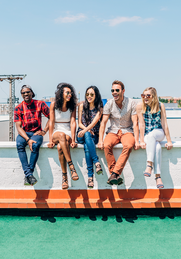 Group of Multi-Ethnic Friends Hanging out in a Rooftop 