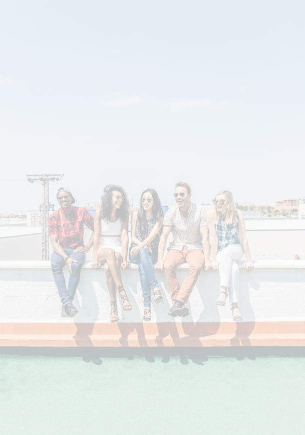 Group of Multi-Ethnic Friends Hanging out in a Rooftop 