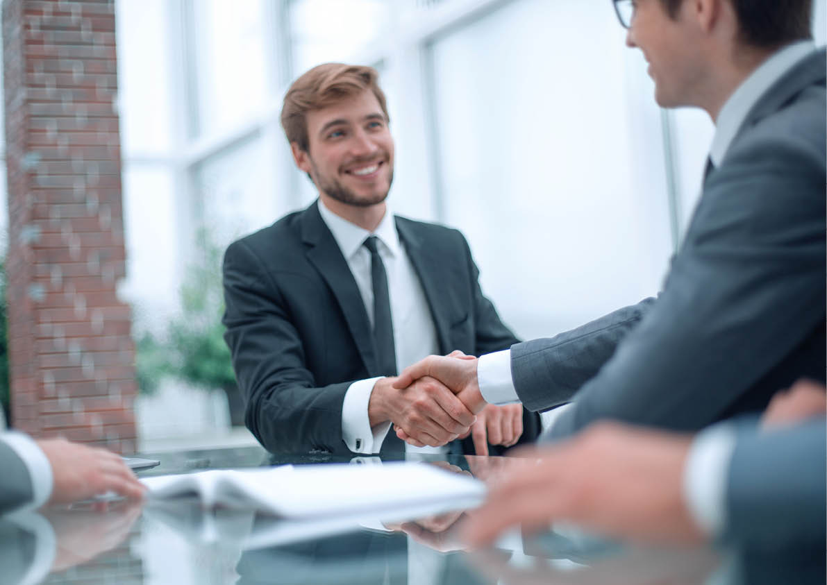 business partners greet each other at a business meeting.