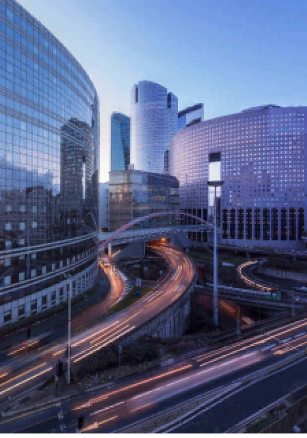 view in Paris overlooking the light trails of passing cars