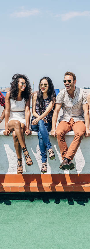 Group of Multi-Ethnic Friends Hanging out in a Rooftop 